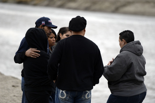 Francisco Kjolseth  |  The Salt Lake Tribune
Family members of Aletha Jo Williams, who was 25 and 6 months pregnant back in 2002 when she went missing, gather on the banks of the Jordan River in West Valley with members of the police department on Friday, Feb. 28, 2014. Some credible information prompted the police to reopen the cold case as they ask for help in finding Williams.