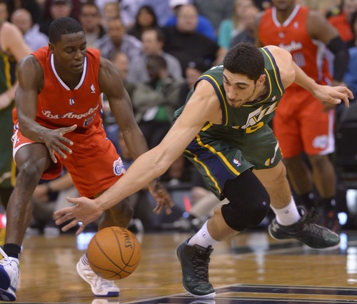 Leah Hogsten  |  The Salt Lake Tribune
Utah Jazz center Enes Kanter (0) hits the deck fighting for a ball with Los Angeles Clippers guard Darren Collison (2). Utah Jazz lead the Los Angeles Clippers 51-43 at the half during their game, Friday, March, 14, 2014 at Energy Solutions Arena.