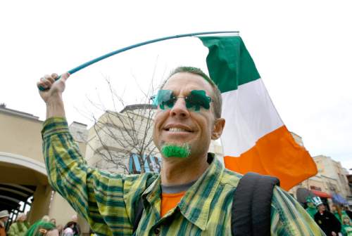 Scott Sommerdorf  |  Tribune file photo
Mark Milligan, part of the Open Classroom contingent, marches in the 2011 St. Patrick's Day Parade through The Gateway. This year's parade and Siamsa is Saturday.