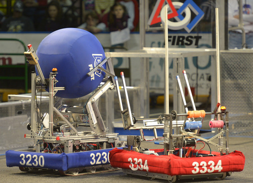 Rick Egan  | The Salt Lake Tribune 

Robots compete in "Aerial Assist,"  competition at the Maverick Center, Saturday, March 15, 2014.