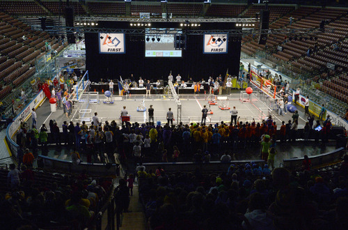 Rick Egan  | The Salt Lake Tribune 

Robots compete in "Aerial Assist,"  competition at the Maverick Center, Saturday, March 15, 2014.  Two robot alliances of three teams each vie to outscore each other during a two-and-a-half minute bout. Winners qualify for the national championship. Forty-eight robots created by almost 2,000 teenage engineers from nine western U.S. states and Alberta, Canada, will compete for the For Inspiration and Recognition of Science and Technology regional robotics competition. Cosponsored by the University of Utah College of Engineering.  The competition cultivates innovators and engineers from 22 Utah high schools and 26 others.  The "Aerial Assist," competition, is a volleyball-meets-soccer event. Two robot alliances of three teams each vie to outscore each other during a two-and-a-half minute bout. Winners qualify for the national championship.