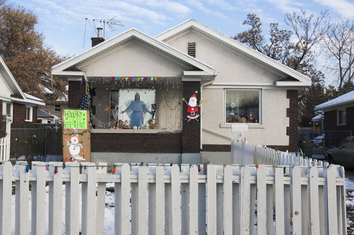 Keith Johnson | The Salt Lake Tribune
This Salt Lake City home covers all the bases in 2007 -- the secular, the sacred, even the political. It boasts a snowman, a Happy Birthday sign, a Santa, an image of Christ and a "Hillary for President" poster.