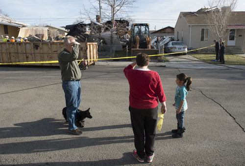 Steve Griffin  |  The Salt Lake Tribune


Neighbors stand outside police lines after a house at 1214 E. 520 South in Provo, Utah exploded and burned Sunday, March 16, 2014.