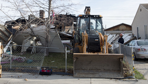 Steve Griffin  |  The Salt Lake Tribune


Provo Fire and Rescue firefighters sift through the rubble of a house at 1214 E. 520 South in Provo, Utah after it exploded and burned Sunday, March 16, 2014.