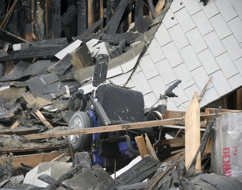 Al Hartmann  |  The Salt Lake Tribune
Questar Gas and Provo Fire Dept. investigate house scene at 1214 East 520 South in Provo that blew up and burned Sunday March 16.  Glenda Wyatt and her dog were pulled from the rubble by neighbors.  She is in serious condition.