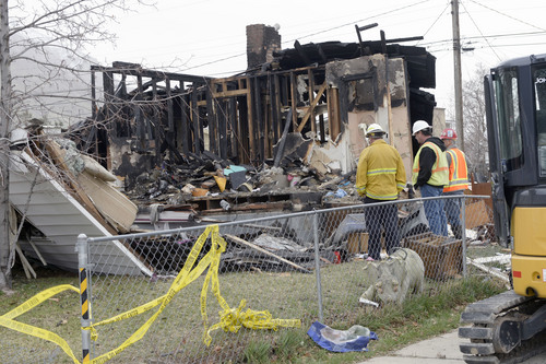Al Hartmann  |  The Salt Lake Tribune
Questar Gas and Provo Fire Dept. investigate house scene at 1214 East 520 South in Provo that blew up and burned Sunday March 16.  Glenda Wyatt and her dog were pulled from the rubble by neighbors.  She is in serious condition.