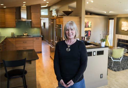 Keith Johnson | The Salt Lake Tribune

Missy Cannell in the redesigned front room and kitchen of her Cliff May-designed home in Salt Lake County, March 12, 2014.The county is re-establishing a Historic Preservation Commission for the unincorporated areas, and one of its first projects is to get a lower Olympus Cove neighborhood onto the Historic Register because it was designed by Cliff May, the "father of the California ranch house" that provided affordable housing in the post-World War II era.
