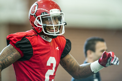 Chris Detrick  |  The Salt Lake Tribune
Utah wide receiver Kenneth Scott laughs during a practice at Spence and Cleone Eccles Football Center Thursday March 20, 2014.