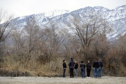 Francisco Kjolseth  |  The Salt Lake Tribune
Salt Lake City police and family of Aletha Jo Williams who was 25 years old and 6 months pregnant when she was last seen March, 2002, gather along the banks of the Jordan River near 2590 S. 1160 East on Friday, Feb. 28, 2014. The Salt Lake City police department was acting on several credible tips that led them to reopen the case and focus on the river.
