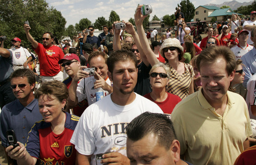 Scores of RSL fans try to catch a glimpse of a ground breaking on Real Salt Lake's new stadium in Sandy on Saturday. 8/12/06 Jim Urquhart/Salt Lake Tribune
