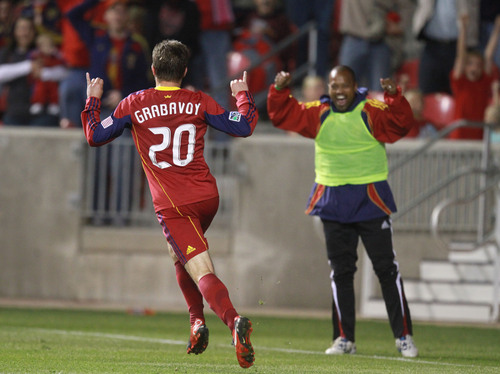 Rick Egan   |  The Salt Lake Tribune

Ned Grabavoy (20) celebrates after scoring a goal as Andy Williams (right) cheers from the sidelines,  in MLS soccer action, Real Salt Lake vs FC Dallas, at Rio TInto Stadium,  Saturday, October 16, 2010.