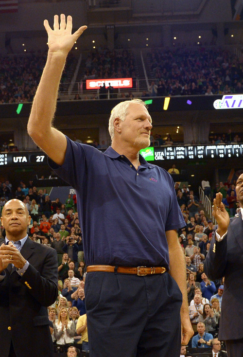 Rick Egan  | The Salt Lake Tribune 

Mark Eaton, former Utah Jazz player from the1983-84 team, waves to the crowd, during a break in the action, during the Utah Jazz, Orlando Magic game, at EnergySolutions Arena Saturday, March 22, 2014.