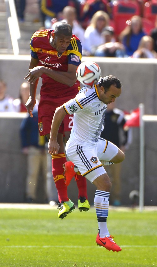 Leah Hogsten  |  The Salt Lake Tribune
Real Salt Lake defender Chris Schuler (28) and Los Angeles Galaxy midfielder Landon Donovan (10) battle for possession. Real Salt Lake and the L.A. Galaxy's game ended in a 1-1 draw Saturday, March 22, 2014 during RSL's home opener at Rio Tinto Stadium.