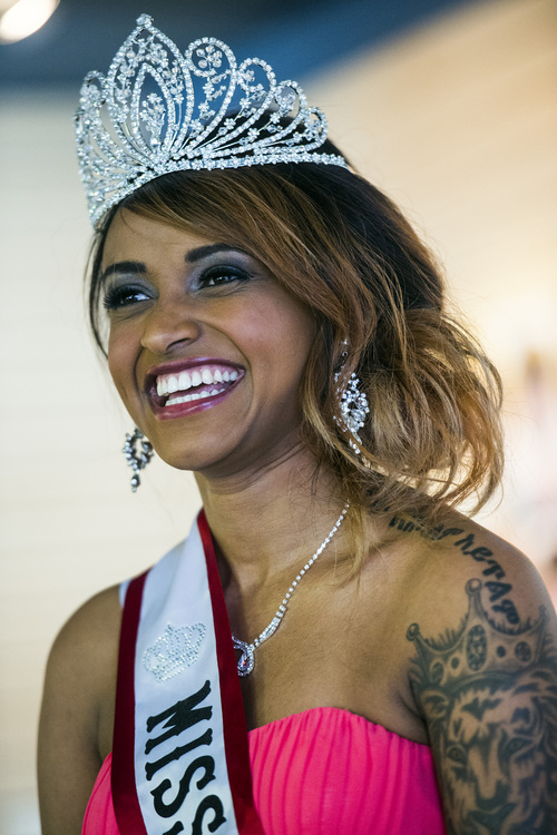 Chris Detrick  |  The Salt Lake Tribune
The newly crowned Miss Africa Utah Muluwerk Hale smiles during a crowing ceremony at One World Gifts in Sugar House Saturday March 22, 2014. Miss Ethiopia, Muluwerk Hale, became Miss Africa Utah after Winnet Murahwa, Miss Zimbabwe, stepped down. "After carefully contemplating on my responsibilities as the queen, I realized that I cannot fulfill all the responsibilities expected of me due to personal reasons," Murahwa said in a statement.