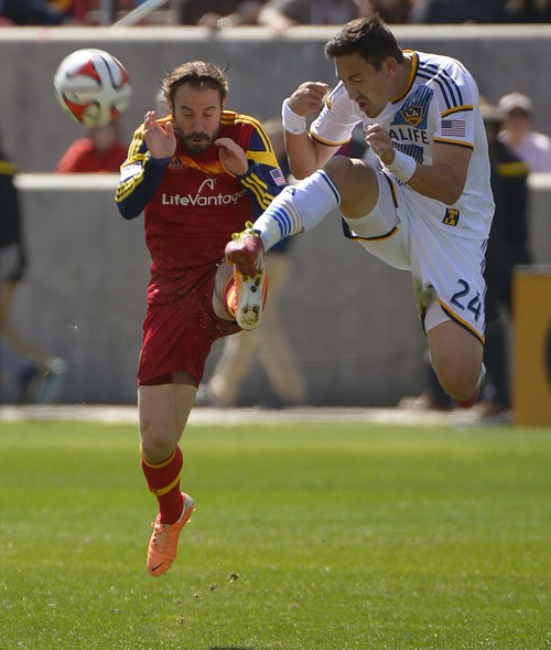 Leah Hogsten  |  The Salt Lake Tribune
Real Salt Lake midfielder Ned Grabavoy (20)and Los Angeles Galaxy midfielder Stefan Ishizaki (24) fight for possession. Real Salt Lake and the L.A. Galaxy are 1-1 at the half during Saturday's, March 22, 2014 home opener at Rio Tinto Stadium.