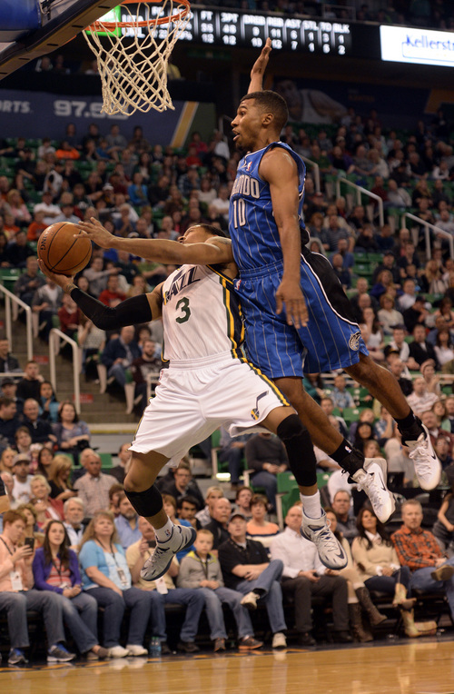Rick Egan  | The Salt Lake Tribune 

Orlando Magic guard Ronnie Price (10) is called for a foul, as he tries to stop Utah Jazz forward Marvin Williams (2) from scoring, in NBA action, The Utah  Jazz vs. the Orlando Magic, at EnergySolutions Arena Saturday, March 22, 2014.