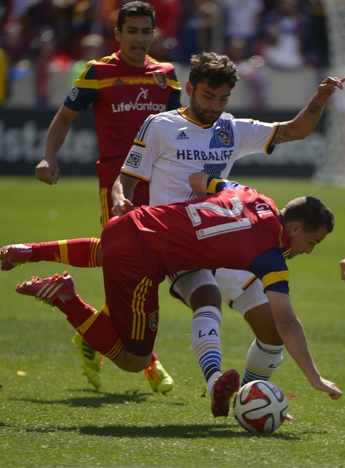 Leah Hogsten  |  The Salt Lake Tribune
Real Salt Lake midfielder Luis Gil (21) tussles with Los Angeles Galaxy midfielder Baggio Husidic (6). Real Salt Lake and the L.A. Galaxy are 1-1 at the half during Saturday's, March 22, 2014 home opener at Rio Tinto Stadium.