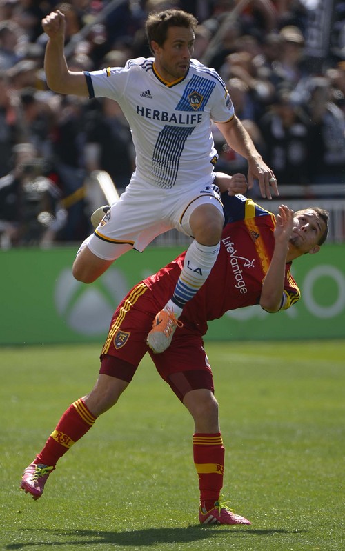 Leah Hogsten  |  The Salt Lake Tribune
Los Angeles Galaxy defender Todd Dunivant (2) falls on Real Salt Lake midfielder Luis Gil (21). Real Salt Lake and the L.A. Galaxy are 1-1 at the half during Saturday's, March 22, 2014 home opener at Rio Tinto Stadium.