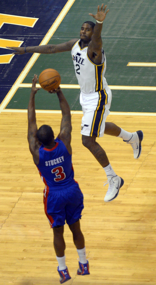 Rick Egan  | The Salt Lake Tribune 

Utah Jazz forward Marvin Williams (2) leaps to try to block a shot by Detroit Pistons guard Rodney Stuckey (3), in NBA action, Jazz vs. The Detroit Pistons, in the EnergySolutions Arena, Monday, March 24, 2014.