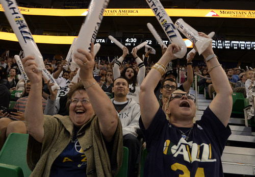 Rick Egan  | The Salt Lake Tribune 

Utah Jazz fans Teresa Sellers (left) and Pollyanna Cash (right) cheer for the Jazz vs. The Detroit Pistons, in the EnergySolutions Arena, Monday, March 24, 2014. Cash has been a Utah Jazz season ticket holder for the past 7 years.