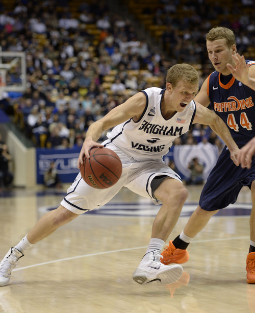 Francisco Kjolseth  |  The Salt Lake Tribune
Brigham Young Cougars guard Tyler Haws (3) drives the ball past Pepperdine in game action at the Marriott Center in Provo on Thursday, Jan. 9, 2014.