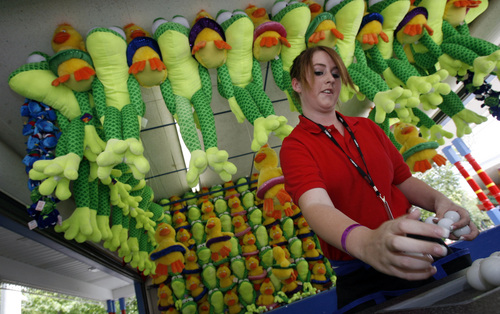 Francisco Kjolseth  |   Tribune file photo

Shayleigh Wixom works the "Plop Plop" game at Lagoon.