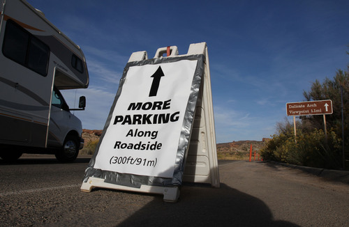 Francisco Kjolseth  |  The Salt Lake Tribune
A sign leads the way to additional parking at the Delicate Arch parking area, one of the most popular areas in the park. Francisco Kjolseth  |  The Salt Lake Tribune
Parking spaces are at a premium during the peak season at the Devils Garden Trailhead in Arches National Park as visitors fill every available spot recently. The infrastructure of Arches National Park was created based on an annual average visitation of 75,000. The park surpassed 1 million visitors in 2010 and is steadily climbing. Officials at Arches are considering options to reduce the number of cars in the park and a shuttle system is one option. However, it would be expensive and, if visitation numbers keep going up, it could soon be obsolete. 