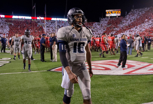Trent Nelson  |  The Salt Lake Tribune
Utah State Aggies quarterback Chuckie Keeton (16) walks off the field after the loss as the University of Utah hosts Utah State, college football Thursday, August 29, 2013 at Rice-Eccles Stadium in Salt Lake City.