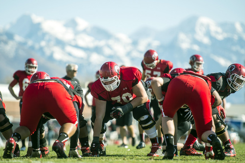 Chris Detrick  |  The Salt Lake Tribune
Utah's Jackson Barton, center, runs drills during a practice at the field west of the Spence & Cleone Eccles Football Center Wednesday March 26, 2014.