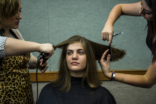Chris Detrick  |  The Salt Lake Tribune
BYU freshman Melissa Smith has ten inches of her hair cut off by Erika Blanchard and Kori Frank at Brigham Young University's Wilkinson Student Center Terrace Wednesday March 26, 2014. The Center for Service and Learning at Brigham Young University  teamed up with Renaissance Academie Cosmetology and Esthetics for their biannual Locks of Love event. Female BYU students can donate their hair to disadvantaged children who suffer from medical-related hair loss.