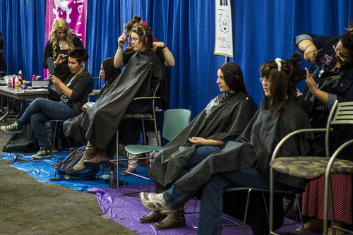 Chris Detrick  |  The Salt Lake Tribune
Students participate in the Locks of Love event at Brigham Young University's Wilkinson Student Center Terrace Wednesday March 26, 2014. The Center for Service and Learning at Brigham Young University  teamed up with Renaissance Academie Cosmetology and Esthetics for their biannual Locks of Love event. Female BYU students can donate their hair to disadvantaged children who suffer from medical-related hair loss.