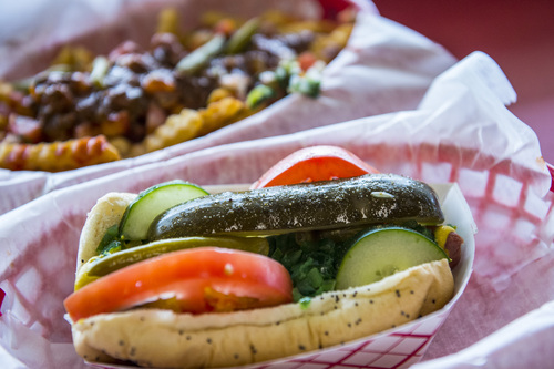 Chris Detrick  |  The Salt Lake Tribune
A Chicago Dog ($3.99) with mustard, onions, green relish, cucumbers, tomatoes, sport peppers, pickle spear, and celery salt and Dirty Fries at Johnniebeefs†in Cottonwood Heights Wednesday March 19, 2014.