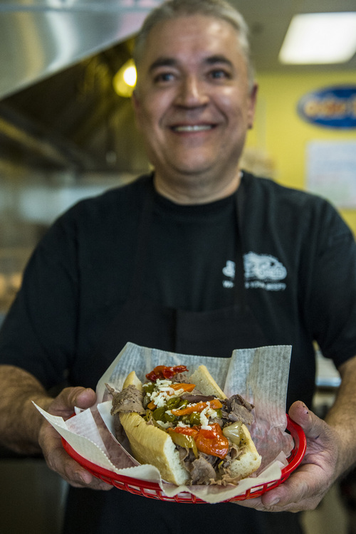 Chris Detrick  |  The Salt Lake Tribune
Owner John Carrsquilla with an Italian Beef Sandwich ($6.99) at Johnniebeefs†in Cottonwood Heights.