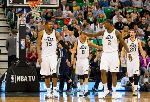 Trent Nelson  |  The Salt Lake Tribune
Utah Jazz forward Marvin Williams (2) high-fives Utah Jazz center Derrick Favors (15) as the Jazz take an early lead. The Utah Jazz face the Memphis Grizzlies, NBA basketball at EnergySolutions Arena in Salt Lake City, Wednesday, March 26, 2014.