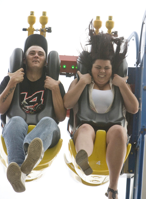 Keith Johnson | Tribune file photo

Phillip Mendoza and Ashley McElyea ride "SPEED" at  the 2013 Utah State Fair. The Office of the Utah State Auditor says the fair, which has been drawing a yearly average of 293,000 visitors, is under-attended.