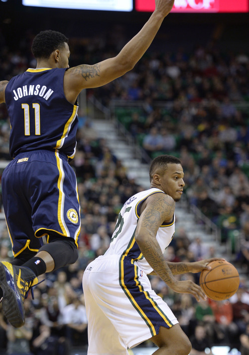 Steve Griffin  |  The Salt Lake Tribune


Utah Jazz shooting guard Brandon Rush (25) goes around a leaping Indiana Pacers shooting guard Orlando Johnson (11) during first half action in the Utah Jazz versus Indiana Pacers at EnergySolutions Arena in Salt Lake City, Utah Thursday, December 5, 2013.
