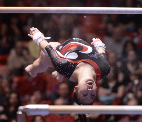 Al Hartmann  |  The Salt Lake Tribune 
University of Utah's Corrie Lathrop looks for her grab on the uneven parallel bars in a gymnastics meet against the University of Washington at the Huntsman Center Friday February 28.