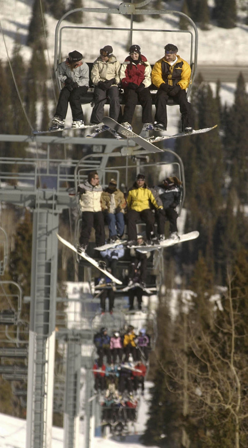 Skiers and snowboarders fill the Eagle Express at Solitude mountain resort on the third and final day of what is traditionally the busiest weekend of the year for Utah's ski industry, with President's day on Monday.  Solitude though busy was not too crowded.   Photo by Francisco Kjolseth/The Salt Lake Tribune 02/16/2004