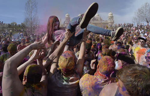 Scott Sommerdorf   |  The Salt Lake Tribune
The Holi festival of colors at the Sri Radha Krishna Temple in Spanish Fork, Saturday, March 29, 2014. Revelers celebrate the arrival of spring on the grounds of the temple.
