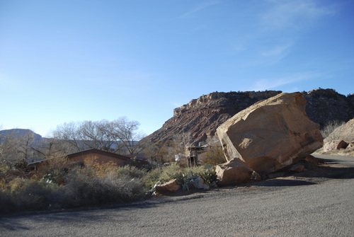 Brian Maffly | The Salt Lake Tribune
A massive boulder sitting near homes in Rockville is a testament to geological hazards documented in a new state report. Realtors have been listing some of the undeveloped lots here.