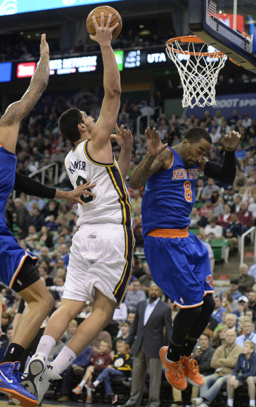 Rick Egan  |  The Salt Lake Tribune

Utah Jazz center Enes Kanter (0) goes in for a lay-up, as New York Knicks guard J.R. Smith (8) defends, in NBA action, Utah Jazz vs the New York Knicks, at EnergySolutions arena, Monday, March 31, 2014