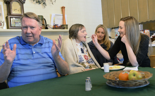 Al Hartmann  |  The Salt Lake Tribune
Merrill Cook, former congressman and perennial candidate, is now a full-time caregiver for his wife, Camille, who suffers from Alzheimer's disease. 
The couple's daughters Alison and Michelle, who are visiting from out of town, help feed breakfast to their mother.