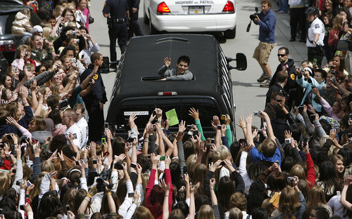 Thousands of screaming fans surround David Archuleta's limo as he leaves the Gateway in Salt Lake City on Friday morning. David Archuleta from Murray, UT., one of American Idol's final three contestants had a whirlwind day in Utah as he visited television and radio stations, followed by a visit to the Gateway, his school and the Jazz game to sing the national anthem.  Photo by Francisco Kjolseth/The Salt Lake Tribune 5/09/2008