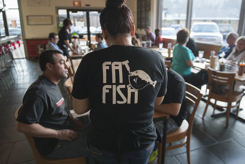 Keith Johnson | The Salt Lake Tribune

Maria Nguyen waits on a table at Fat Fish, a new sushi and pho restaurant  in West Valley City, March 24, 2014.