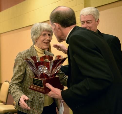 Al Hartmann  |  The Salt Lake Tribune
Long time homeless advocate Pamela Atkinson, left, accepts award at the annual Dream Builder's Breakfast in Ogden April 2.  Executive Director of Catholic Catholic Community Services of Utah Brad Drake and Most Reverend Bishop John C.  Wester, right.  Catholic Community Services (CCS) hosted the annual Dream Builder's Breakfast; honoring those in the community making a difference. Funds raised at the breakfast will help in establishing a new child hunger program called Bridging the Gap.
