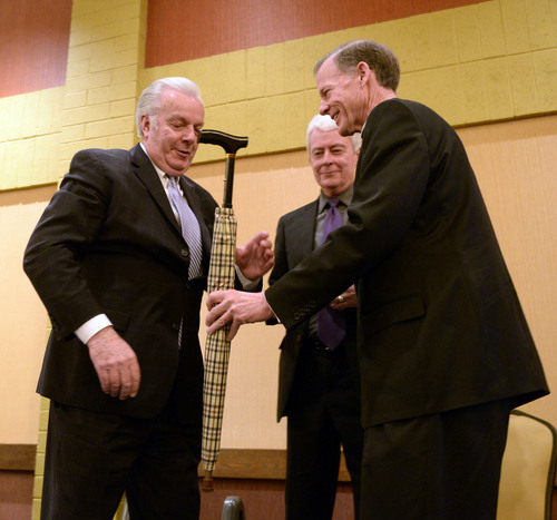 Al Hartmann  |  The Salt Lake Tribune
Robert A. Hunter of United Way of Northern Utah  accepts an umbrella as part of his award at the annual Dream Builder's Breakfast in Ogden April 2.  Executive Director of Catholic Catholic Community Services of Utah Brad Drake and Most Reverend Bishop John C.  Wester, right. Catholic Community Services (CCS) hosted the annual Dream Builder's Breakfast; honoring those in the community making a difference. Funds raised at the breakfast will help in establishing a new child hunger program called Bridging the Gap.