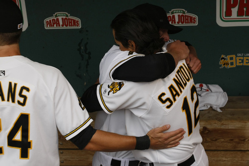 Salt Lake Bees Brad Coon and Freddy Sandoval hug during the team's season opener Friday night. Salt Lake's opener was originally scheduled for Thursday night but was postponed following the death of former Bees pitcher Nick Adenhart.
 
Chris Detrick/The Salt Lake Tribune