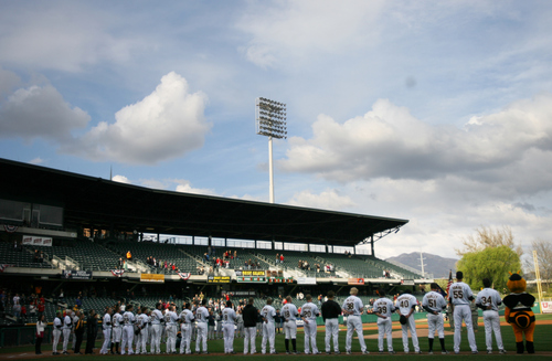 Kim Raff | The Salt Lake Tribune
The Bees players line up on the field for the Pledge of Allegiance during the Bees home opener against Tucson Padres at Spring Mobile Ballpark in Salt Lake City, Utah on April 13, 2012.