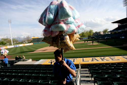 Kim Raff | The Salt Lake Tribune
A concessions worker makes a trip around the park to sell cotton candy before the Bees homeopener against Tucson Padres at Spring Mobile Ballpark in Salt Lake City, Utah on April 13, 2012.