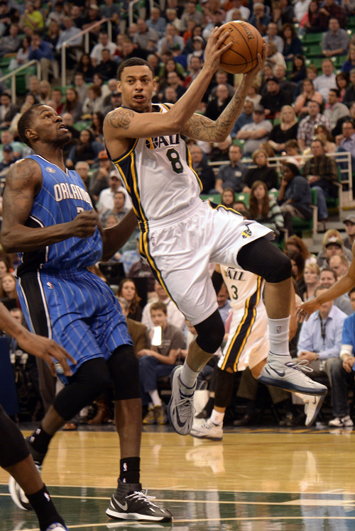 Rick Egan  | The Salt Lake Tribune 

Utah Jazz guard Diante Garrett (8) flies up the middle as he looks for a team mate to pass to, in NBA action, The Utah  Jazz vs. the Orlando Magic, at EnergySolutions Arena Saturday, March 22, 2014.